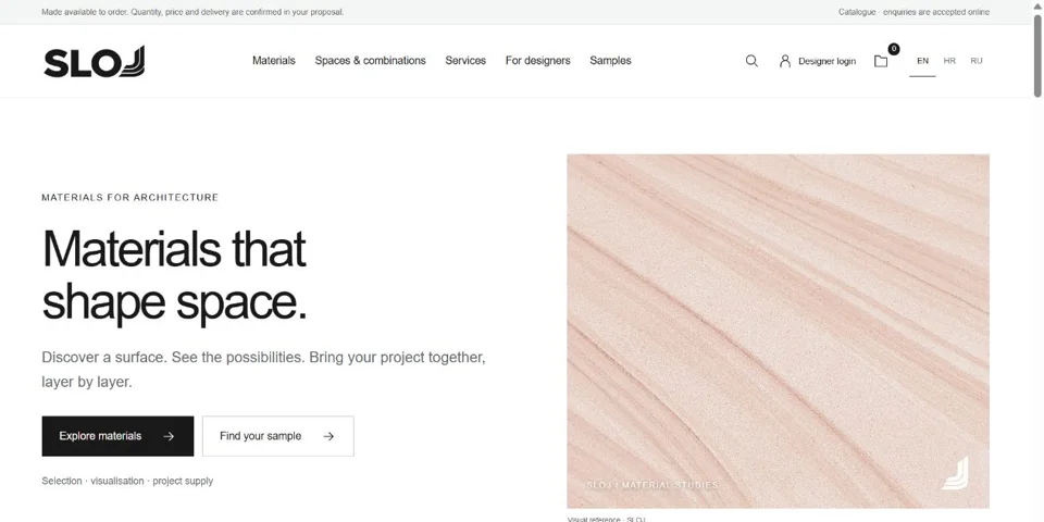 SLOJ materials website homepage with editorial typography and a stone surface